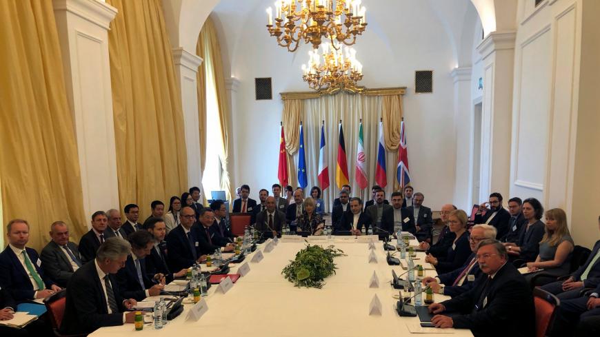 Iran's top nuclear negotiator Abbas Araqchi and EEAS Secretary General Helga Schmid attend a meeting of the JCPOA Joint Commission in Vienna, Austria July 28, 2019.  REUTERS/Kirsti Knolle - RC13C68A4E90