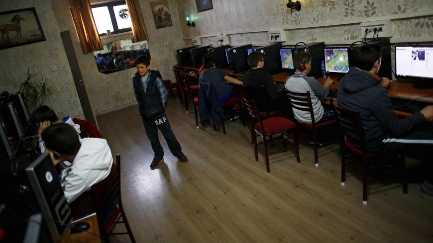 People use computers at an internet cafe in Ankara April 6, 2015. Twitter has complied with Turkey's request to remove images of an Istanbul prosecutor held at gunpoint by far-left militants and the block of access to is about to be lifted, a Turkish official told Reuters on Monday. Turkey banned access to the micro-blogging site and YouTube after they refused a request to remove photographs of Mehmet Kiraz, a prosecutor killed in a shootout last week. REUTERS/Umit Bektas  - GF10000051058