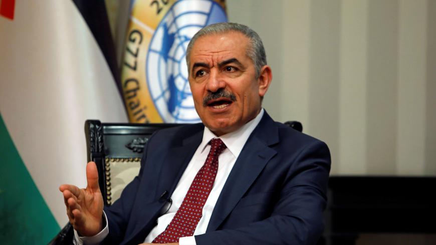 Palestinian Prime Minister Mohammad Shtayyeh gestures during an interview with Reuters in his office in Ramallah, in the Israeli-occupied West Bank, June 27, 2019. REUTERS/Raneen Sawafta - RC1C9C2B1E70