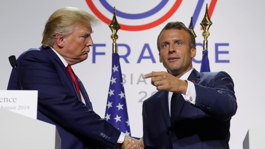French President Emmanuel Macron shakes hands with U.S. President Donald Trump during a joint press conference at the end of the G7 summit in Biarritz, France, August 26, 2019.  REUTERS/Philippe Wojazer - RC128C49AAC0