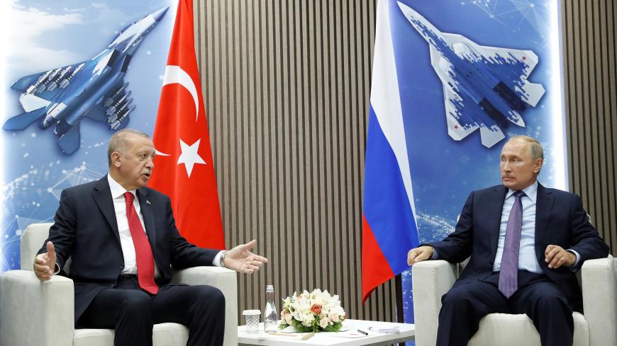 Russian President Vladimir Putin and Turkish President Recep Tayyip Erdogan speak during their meeting on the sidelines of the MAKS-2019 International Aviation and Space Salon in Zhukovsky outside Moscow, Russia, August  27, 2019. Maxim Shipenkov/Pool via REUTERS - RC147D99BA60