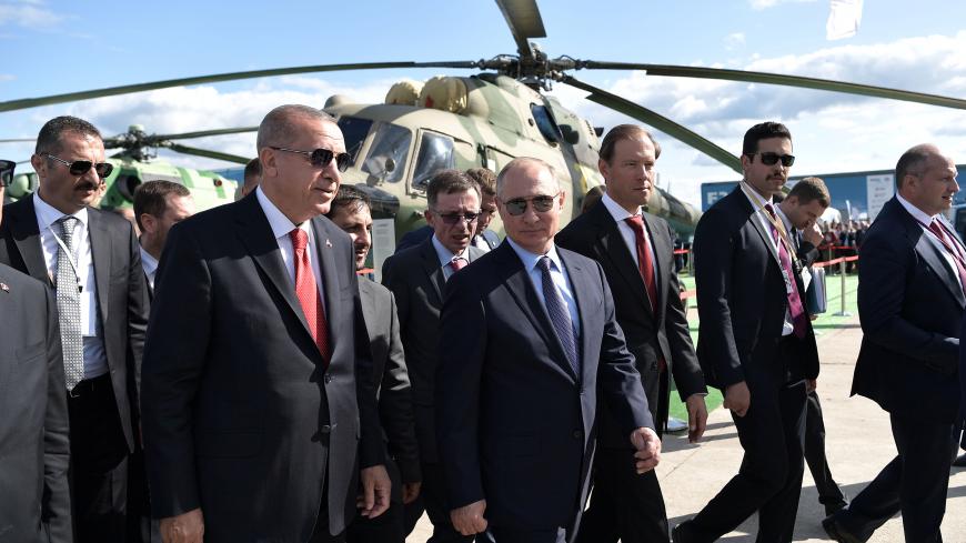 Russian President Vladimir Putin and his Turkish counterpart Recep Tayyip Erdogan visit the MAKS 2019 air show in Zhukovsky, outside Moscow, Russia, August 27, 2019.  Sputnik/Aleksey Nikolskyi/Kremlin via REUTERS ATTENTION EDITORS - THIS IMAGE WAS PROVIDED BY A THIRD PARTY. - RC159965E0E0