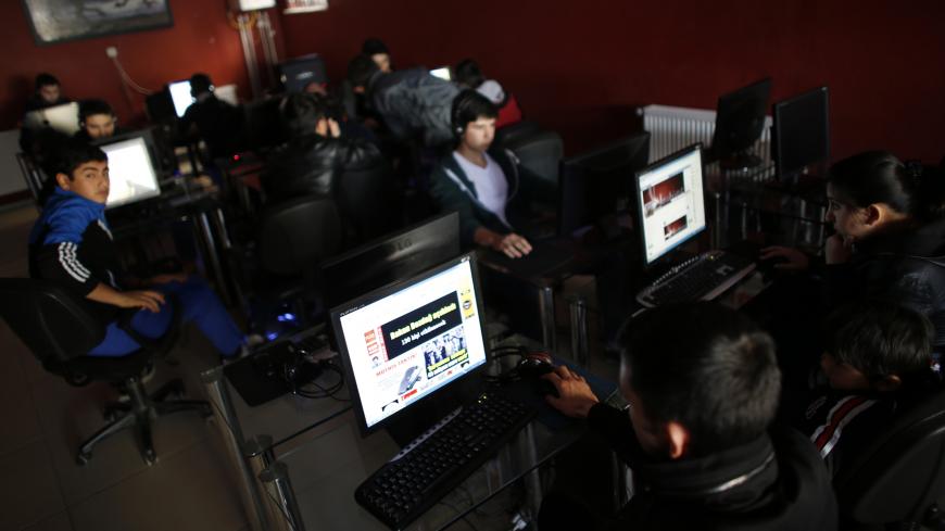 People use computers at an internet cafe in Ankara February 6, 2014. Turkey's parliament, where Prime Minister Tayyip Erdogan's AK Party has a majority, has approved internet controls enabling web pages to be blocked within hours in what the opposition decried as part of a government bid to stifle a corruption scandal with methods more suitable to "times of coups". Under a bill passed late on Wednesday, telecommunications authorities can block access to material within four hours without a prior court order