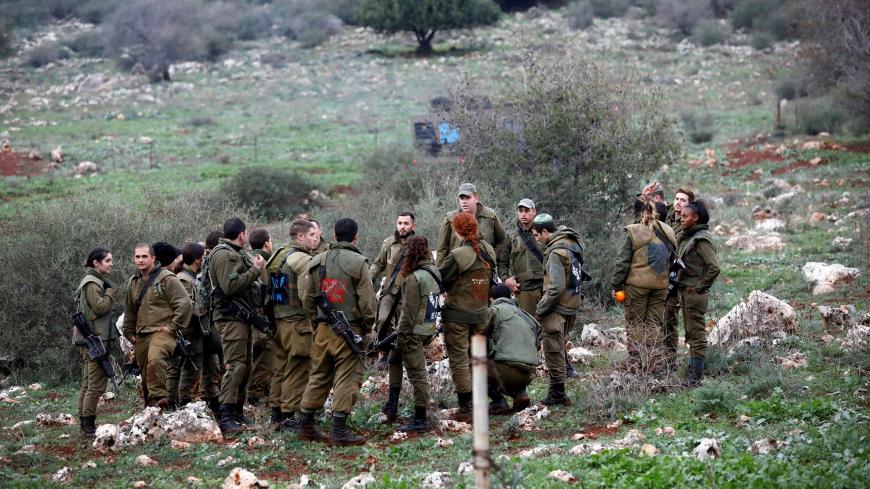Israeli soldier gather in a field near the border between Israel and Lebanon at its Israel side December 9, 2018. REUTERS/Amir Cohen - RC16DC63CFD0