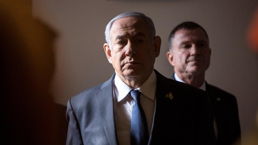 Israeli Prime Minister Benjamin Netanyahu arrives to a ceremony on Memorial Day, when Israel commemorates its fallen soldiers, at Mount Herzl in Jerusalem May 8, 2019. Heidi Levine/Pool via REUTERS - RC1FBD4D67D0