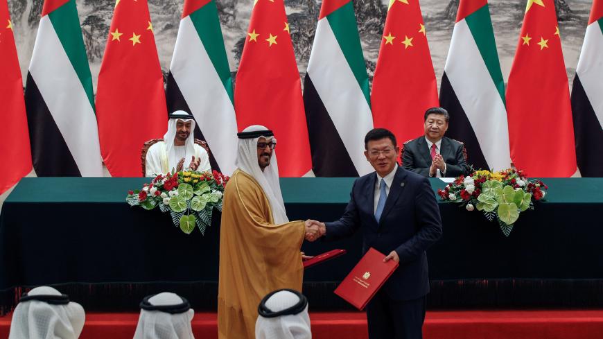 Abu Dhabi's Crown Prince Sheikh Mohammed bin Zayed Al Nahyan and Chinese President Xi Jinpin applaud as they witness a signing ceremony at the Great Hall of the People in Beijing, Monday, July 22, 2019. Andy Wong/Pool via REUTERS - RC1F7C215B10