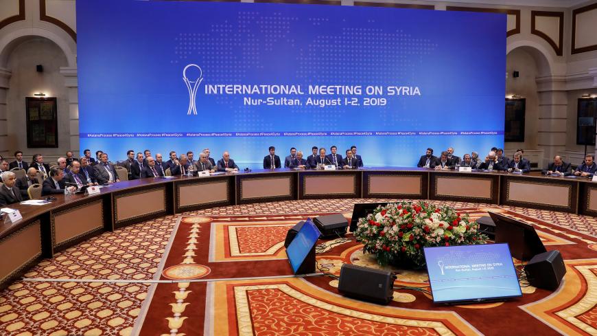 Officials attend a session of the peace talks on Syria in Nur-Sultan, Kazakhstan August 2, 2019. REUTERS/Mukhtar Kholdorbekov - RC11F7E4FF00