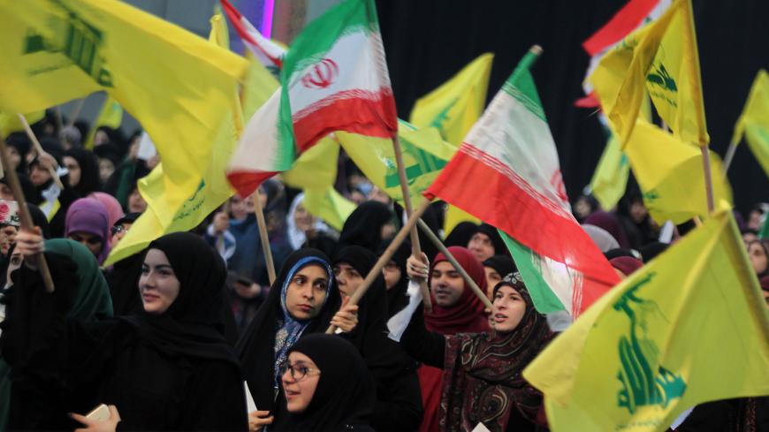 06 February 2019, Lebanon, Beirut: Supporters of Hezbollah, the pro-Iranian Lebanese Islamist political party and militant group, wave flags of Iran and Hezbollah during a rally to mark the 40th anniversary of the Iranian Islamic Revolution which toppled Mohammad Reza Pahlavi, the last Shah of Iran. Photo: Marwan Naamani/dpa (Photo by Marwan Naamani/picture alliance via Getty Images)