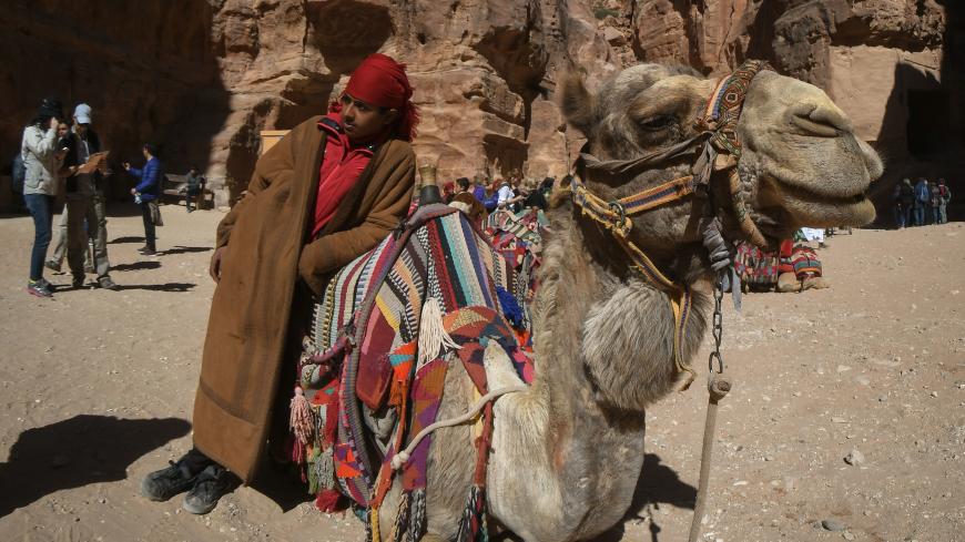 A member of Al B'doul, a Bedouin tribe with his camel awaiting for tourists outside Petra's most elaborate ruin, Al Khazneh (the Treasury).
On Saturday, February 10, 2019, in Petra, Ma'an Governorate, Jordan. (Photo by Artur Widak/NurPhoto via Getty Images)