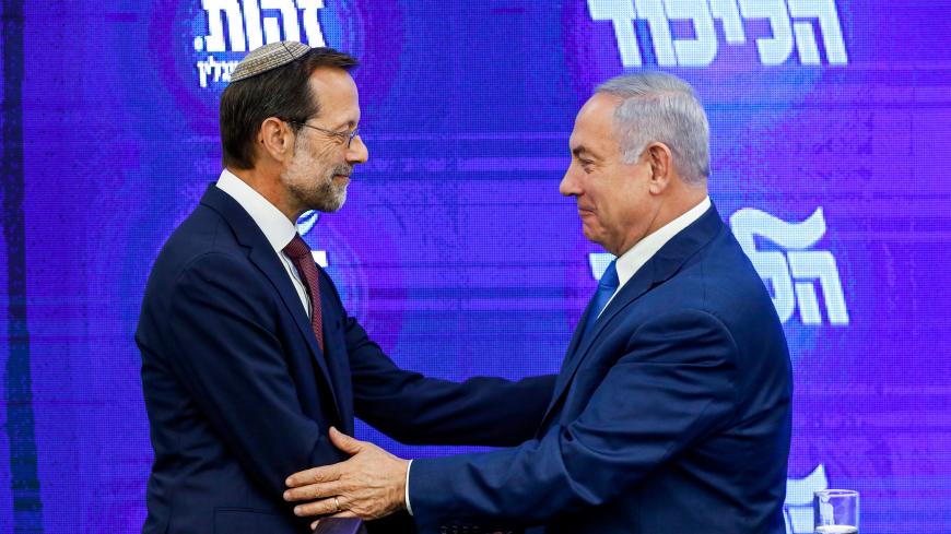 Israeli Prime Minister and Likud Chairman Benjamin Netanyahu (R) shakes hands with with far-right Zehout (identity) political party chairman Moshe Feiglin (L) during a joint press statement in Ramat Gan, near the Israeli coastal city of Tel Aviv on August 29, 2019. (Photo by Jack GUEZ / AFP)        (Photo credit should read JACK GUEZ/AFP/Getty Images)