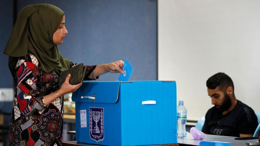 Israeli Arabs vote during Israel's parliamentary election at a polling station in Kafr Manda near Haifa on September 17, 2019. (Photo by Ahmad GHARABLI / AFP)        (Photo credit should read AHMAD GHARABLI/AFP/Getty Images)