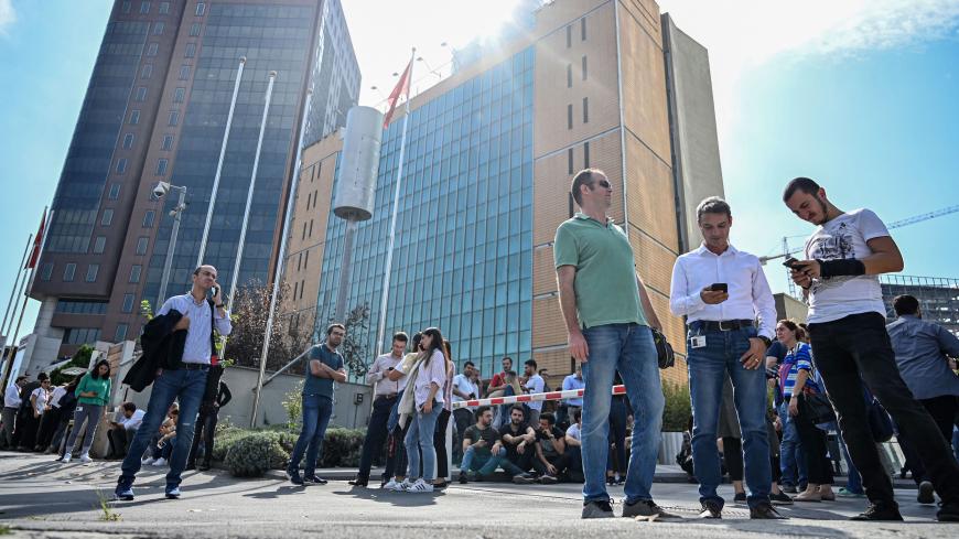 Office workers gather after fleeing their buildings in the Maslak District of Istanbul on September 26, 2019, following an earthquake in the city. - A 5.7-magnitude earthquake shook Turkey's largest city, driving residents to evacuate buildings, AFP journalists witnessed. (Photo by Ozan KOSE / AFP)        (Photo credit should read OZAN KOSE/AFP/Getty Images)