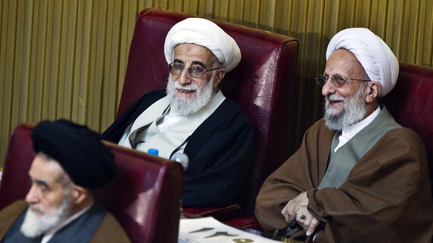 EDITORS' NOTE: Reuters and other foreign media are subject to Iranian restrictions on leaving the office to report, film or take pictures in Tehran.

Guardian Council Chief Ayatollah Ahmad Jannati (top L) and Ayatollah Mohammad-Taqi Mesbah (R) listen to the opening speech during Iran's Assembly of Experts' biannual meeting in Tehran March 8, 2011. Former Iranian president Akbar Hashemi Rafsanjani lost his position on Tuesday as head of an important state clerical body after hardliners criticised him for bei