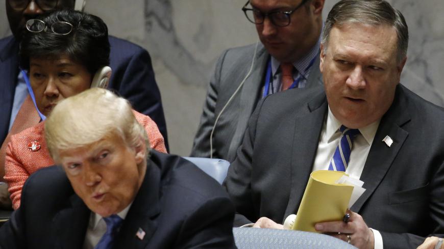U.S. President Donald Trump speaks as U.S. Secretary of State Mike Pompeo (R) listens during a meeting of the United Nations Security Council held during the 73rd session of the United Nations General Assembly at U.N. headquarters in New York, U.S., September 26, 2018. REUTERS/Eduardo Munoz - HP1EE9Q16H0BY