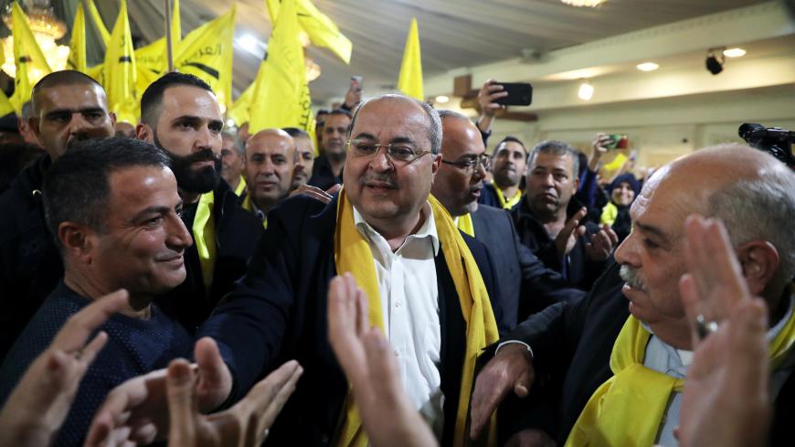 Ahmad Tibi, leader of the Ta'al party faction, is surrounded by supporters during an election campaign event in the Wadi Ara, in northern Israel February 2, 2019. Picture taken February 2, 2019. REUTERS/Ammar Awad - RC1BF8975AF0