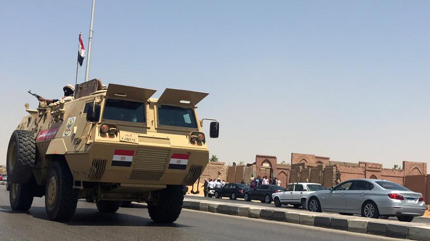 An Egyptian military vehicle patrols on the highway, outside the cemetary were ousted Egyptian Islamist President Mohamed Mursi was buried, early morning in Cairo, Egypt June 18, 2019. REUTERS/Amr Abdallah Dalsh - RC139FE68710