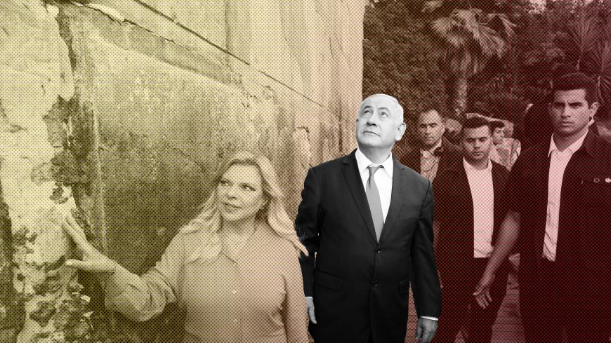 Israeli Prime Minister Benjamin Netanyahu looks up while his wife Sara touches the outside wall of the Cave of the Patriarchs, a shrine holy to Jews and Muslims during a state memorial ceremony, in Hebron in the Israeli-occupied West Bank September 4, 2019. Emil Salman/Pool via REUTERS - RC1F2AE58F00