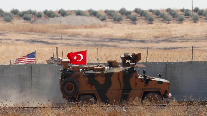 A Turkish military vehicle returns after a joint U.S.-Turkey patrol in northern Syria, as it is pictured from near the Turkish town of Akcakale, Turkey, September 8, 2019. REUTERS/Murad Sezer - RC1967E7F3C0