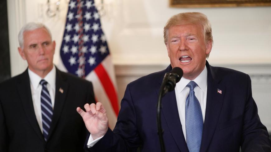 U.S. President Donald Trump delivers a statement on the conflict in Syria with Vice President Mike Pence at his side in the Diplomatic Room of the White House in Washington, U.S., October 23, 2019. REUTERS/Tom Brenner - RC1C5194D700