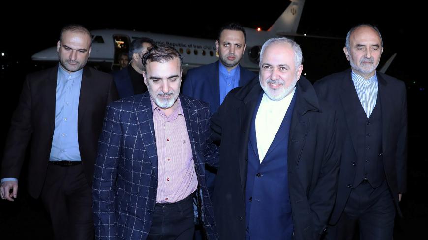 Iran's Foreign Minister Mohammad Javad Zarif walks with Iranian professor Massoud Soleimani as he arrives at Mehrabad airport, in Tehran, Iran December 7, 2019. West Asia News Agency (WANA) via REUTERS ATTENTION EDITORS - THIS IMAGE HAS BEEN SUPPLIED BY A THIRD PARTY - RC2JQD93R47U