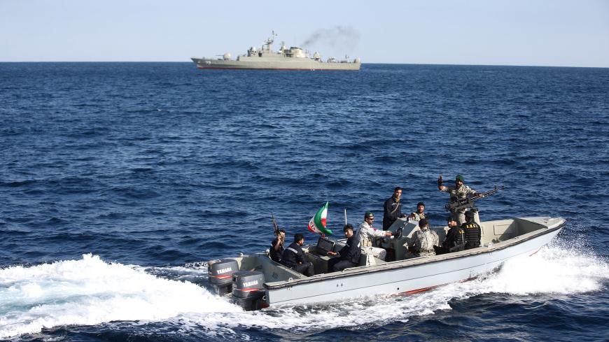 Iranian marine soldiers wave to the camera from a motor boat in the Sea of Oman during the third day of joint Iran, Russia and China naval war games in Chabahar port, at the Sea of Oman, Iran, December 29, 2019. Mohsen Ataei/Fars news agency/WANA (West Asia News Agency) via REUTERS ATTENTION EDITORS - THIS IMAGE HAS BEEN SUPPLIED BY A THIRD PARTY - RC235E95KV40