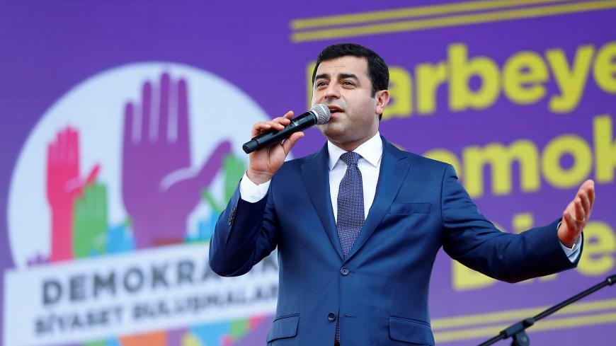 The leader of Turkey's pro-Kurdish opposition Peoples' Democratic Party (HDP) Selahattin Demirtas, makes a speech during a rally in Istanbul, Turkey, June 5, 2016. REUTERS/Osman Orsal - D1BETIDULRAB