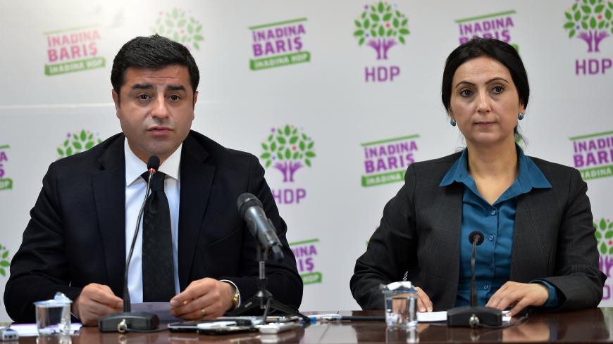 Co-chairs of the pro-Kurdish Peoples' Democratic Party (HDP), Selahattin Demirtas (L) and Figen Yuksekdag hold a news conference in Ankara, Turkey, November 1, 2015. Turkey looked set to return to single-party rule after the Islamist-rooted AK Party swept to an unexpected victory in elections on Sunday, an outcome that will boost the power of President Tayyip Erdogan but may sharpen deep social divisions.   REUTERS/Stringer/Turkey - LR2EBB11L8L9N