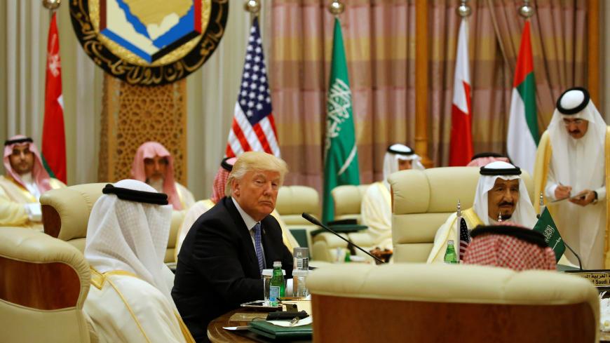 U.S. President Donald Trump sits down to a meeting with of Gulf Cooperation Council leaders, including Saudi Arabia's King Salman bin Abdulaziz Al Saud (R), during their summit in Riyadh, Saudi Arabia May 21, 2017. REUTERS/Jonathan Ernst - RC19B4965AE0