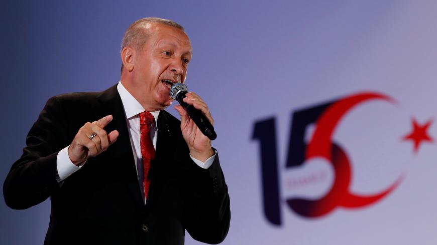 Turkish President Tayyip Erdogan addresses his supporters during a ceremony marking the third anniversary of the attempted coup at Ataturk Airport in Istanbul, Turkey, July 15, 2019. REUTERS/Murad Sezer - RC191F892920