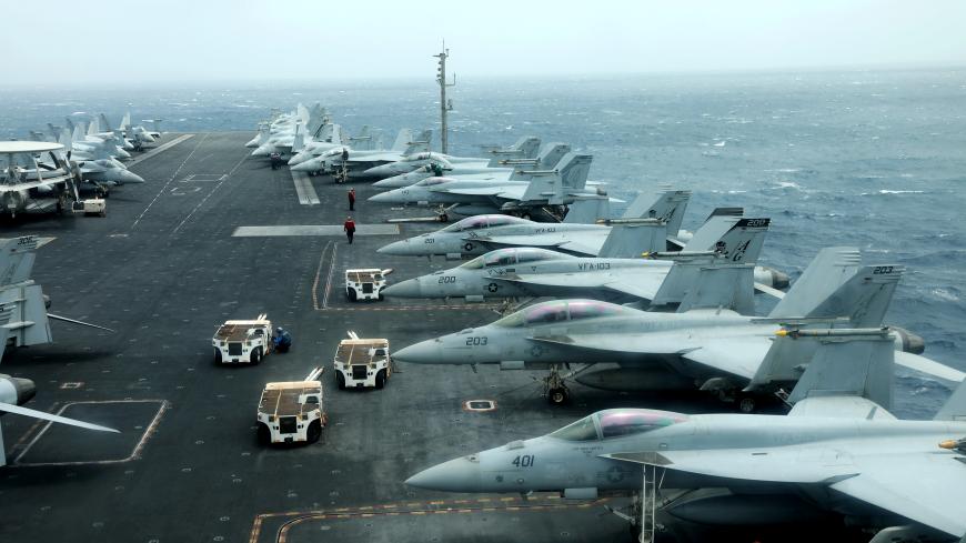 F/A-18F aircrafts are seen on the deck of USS Abraham Lincoln in the Gulf of Oman near the Strait of Hormuz July 15, 2019. Picture taken July 15, 2019. REUTERS/Ahmed Jadallah     TPX IMAGES OF THE DAY - RC1D37D6D440