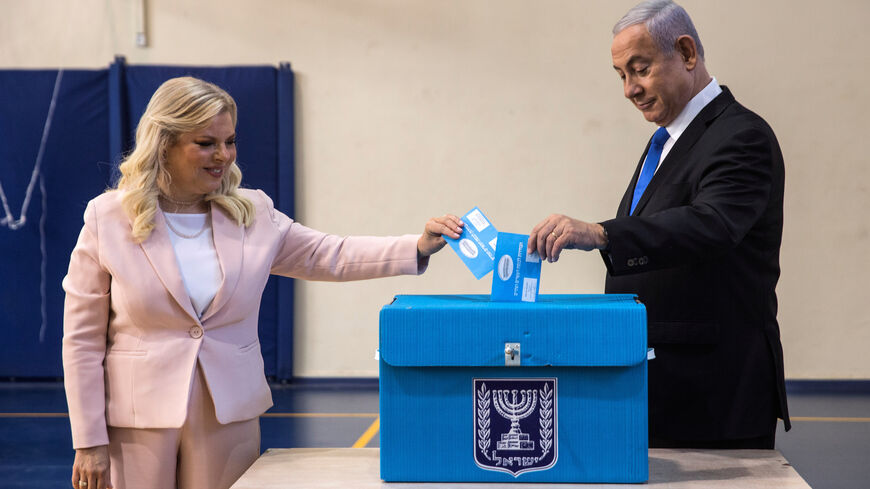 Israeli Prime Minister Benjamin Netanyahu and his wife Sara cast their vote during Israel's parliamentary election at a polling station in Jerusalem September 17, 2019. Heidi Levine/Pool via REUTERS - RC1633543E50