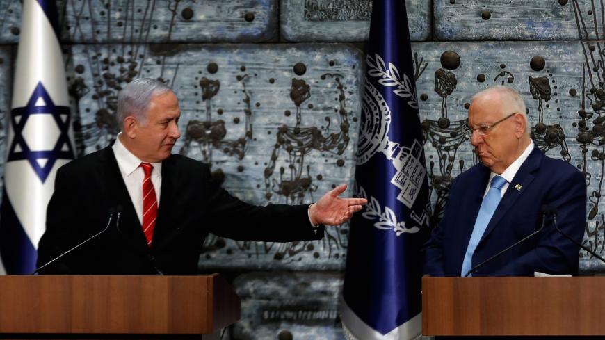 Israeli President Reuven Rivlin and Prime Minister Benjamin Netanyahu attend a nomination ceremony at the President's residency in Jerusalem September 25, 2019. REUTERS/Ronen Zvulun/ - RC139CE03AC0