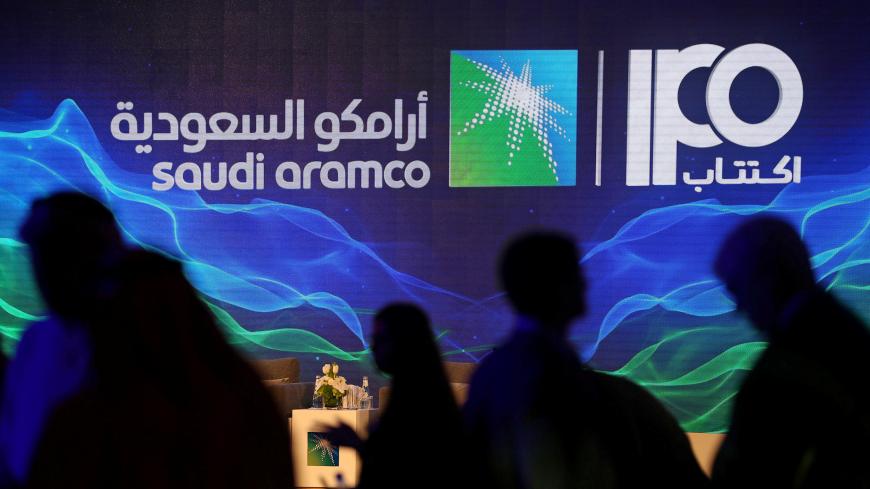 A sign of Saudi Aramco's initial public offering (IPO) is seen during a news conference by the state oil company at the Plaza Conference Center in Dhahran, Saudi Arabia November 3, 2019. REUTERS/Hamad I Mohammed     TPX IMAGES OF THE DAY - RC1925242170