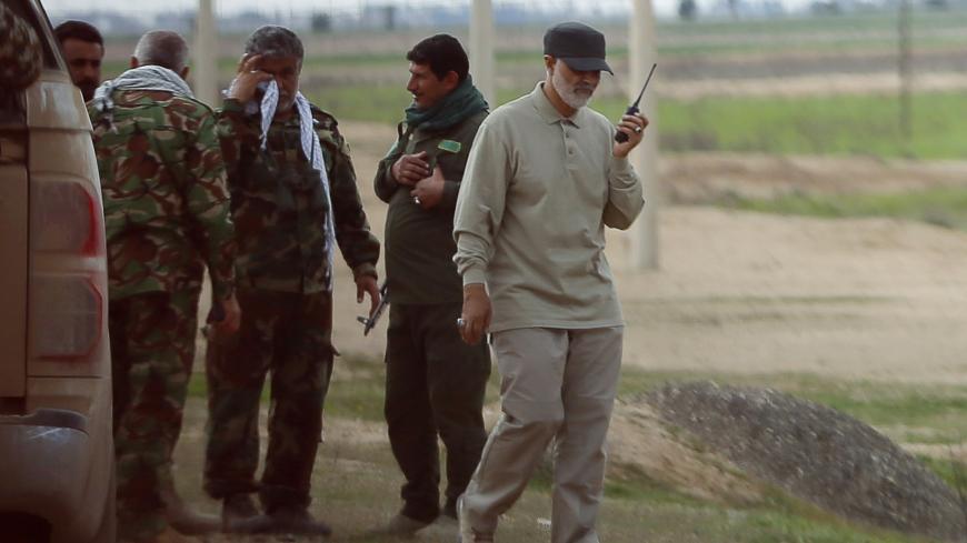 Iranian Revolutionary Guard Commander Qassem Soleimani uses a walkie-talkie at the frontline during offensive operations against Islamic State militants in the town of Tal Ksaiba in Salahuddin province March 8, 2015. Picture taken March 8, 2015.   REUTERS/Stringer (IRAQ - Tags: CIVIL UNREST CONFLICT POLITICS) - GM1EB3I1GO301