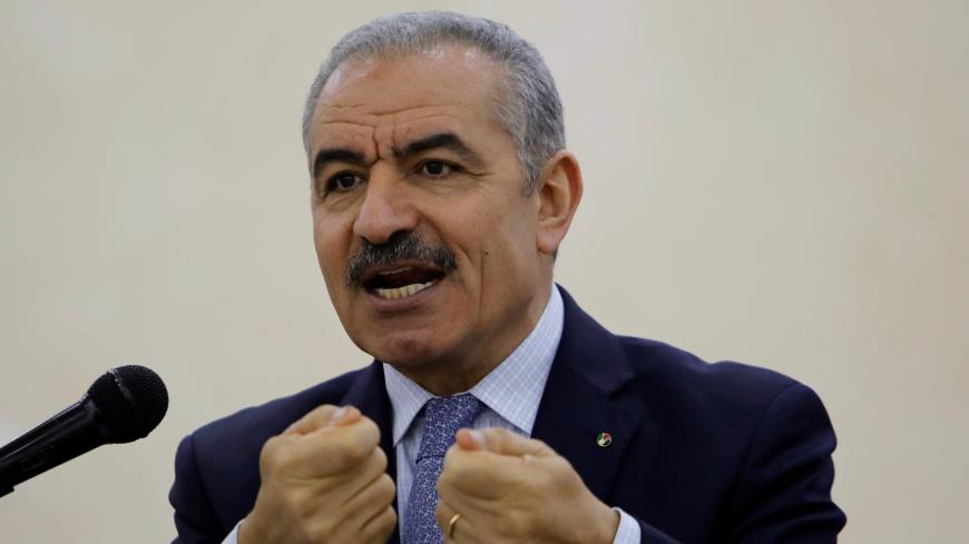 Palestinian Prime Minister Mohammad Shtayyeh gestures as he speaks during a cornerstone-laying ceremony for a water and energy project in Tubas, in the Israeli-occupied West Bank June 20, 2019. REUTERS/Raneen Sawafta - RC1DFB44F770