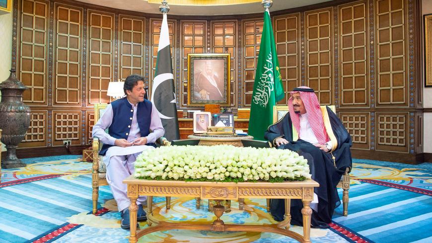 Saudi Arabia's King Salman meets with Pakistani Prime Minister Imran Khan in Riyadh, Saudi Arabia, October 15, 2019.  Bandar Algaloud/Courtesy of Saudi Royal Court/Handout via REUTERS ATTENTION EDITORS - THIS IMAGE WAS PROVIDED BY A THIRD PARTY. - RC1FB4090FF0
