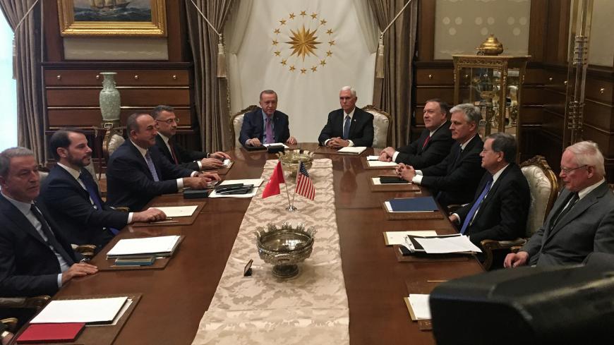 Turkish President Recep Tayyip Erdogan (C-L) and U.S. Vice President Mike Pence (C-R), joined by Secretary of State Mike Pompeo (4R), Turkish Vice President Fuat Oktay, Turkish Foreign Minister Mevlut Cavusoglu (3L) and senior aides, meet at the presidential complex in Ankara, Turkey, October 17, 2019.  Shaun Tandon/Pool via REUTERS - RC1876FD8060