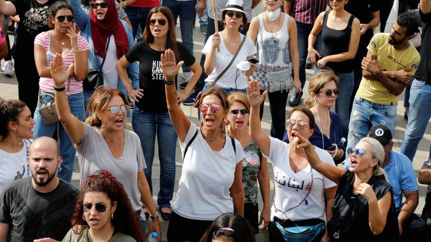 Women gesture and chant slogans during a protest over deteriorating economic situation, in Beirut, Lebanon October 18, 2019. REUTERS/Mohamed Azakir - RC1F1358A730