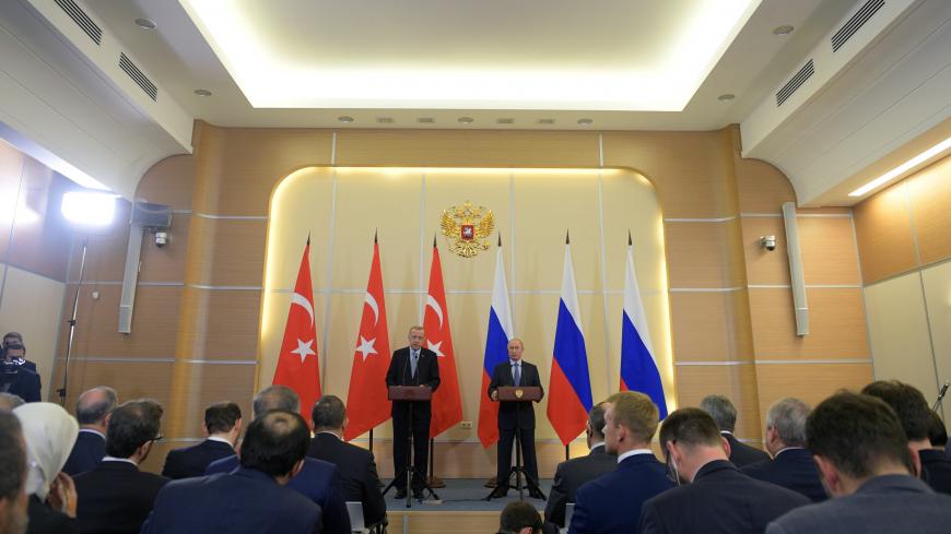 Russian President Vladimir Putin and Turkish President Tayyip Erdogan attend a news conference following their talks in Sochi, Russia October 22, 2019. Sputnik/Alexei Druzhinin/Kremlin via REUTERS  ATTENTION EDITORS - THIS IMAGE WAS PROVIDED BY A THIRD PARTY. - RC1AC62B4210