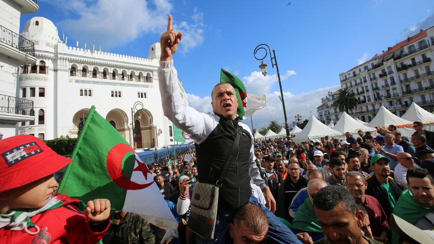 A demonstrator gestures as he shouts slogans during a protest against the country's ruling elite and rejecting December presidential election in Algiers, Algeria October 25, 2019. REUTERS/Ramzi Boudina - RC199B1A09B0