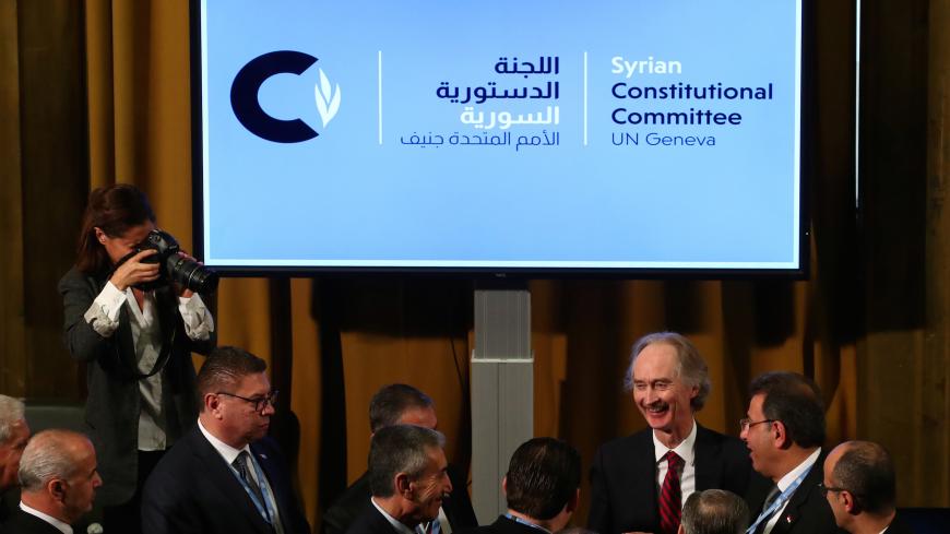 U.N. Special Envoy for Syria Geir Pedersen talks with Ahmad Kuzbari, co-chair for the Syrian Government, and other members ot their delegation after the first meeting of the new Syrian Constitutional Committee at the United Nations in Geneva, Switzerland, October 30, 2019. REUTERS/Denis Balibouse - RC145F453450