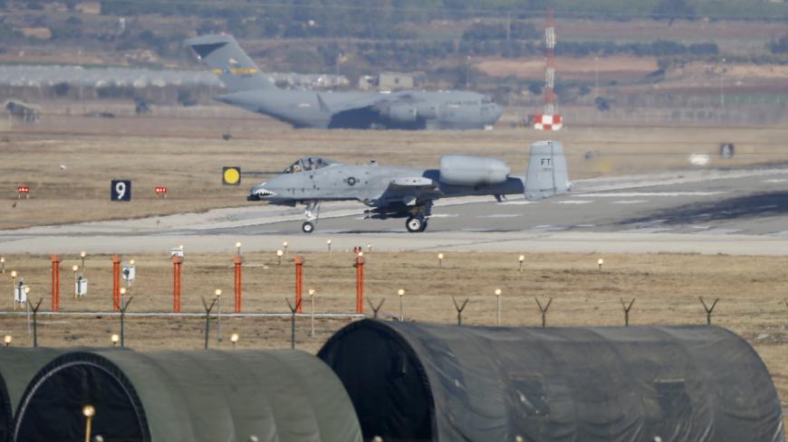 A U.S. Air Force A-10 Thunderbolt II fighter jet (foreground) lands at Incirlik airbase in the southern city of Adana, Turkey, December 11, 2015. REUTERS/Umit Bektas - GF10000262265