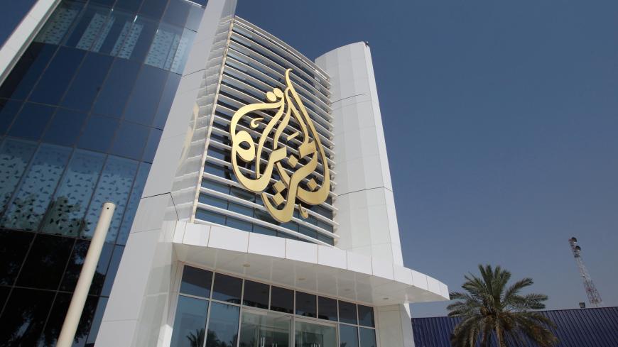 The Al Jazeera Media Network logo is seen on its headquarters building in Doha, Qatar June 8, 2017. REUTERS/Naseem Zeitoon - RC1774CFAD70