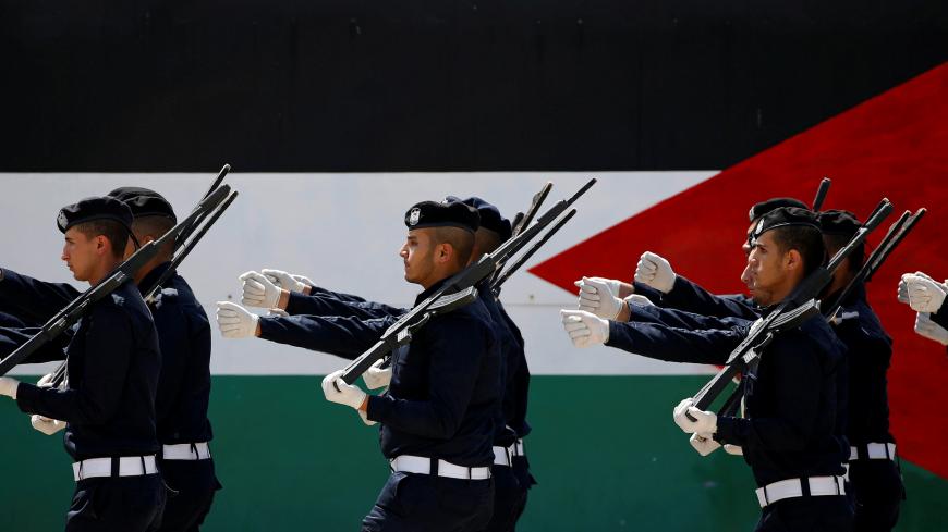 Palestinian police cadets march during a graduation ceremony at a police college run by the Hamas-led interior ministry, in Gaza City July 16, 2019. REUTERS/Mohammed Salem - RC13042EB640