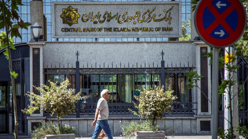 A man walks past the Central bank of Iran in Tehran, Iran August 1, 2019. Nazanin Tabatabaee/WANA (West Asia News Agency) via REUTERS  ATTENTION EDITORS - THIS PICTURE WAS PROVIDED BY A THIRD PARTY - RC11AFC63C40