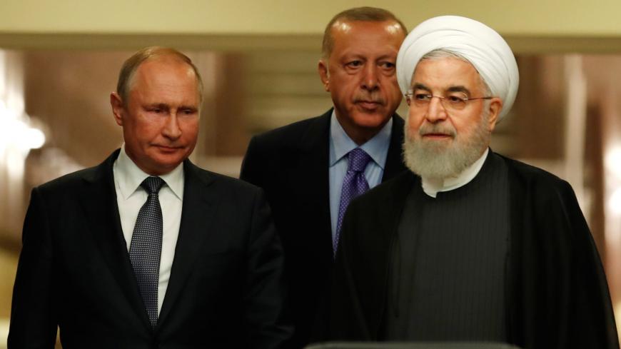 Presidents Hassan Rouhani of Iran, Tayyip Erdogan of Turkey and Vladimir Putin of Russia arrive for a news conference in Ankara, Turkey, September 16, 2019. REUTERS/Umit Bektas - RC1D1AF89BB0