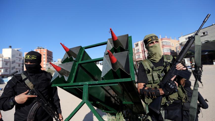 Palestinian Islamic jihad militants display rockets during a military show marking the 32nd anniversary of the organisation's founding, in the central Gaza Strip October 3, 2019. REUTERS/Ibraheem Abu Mustafa - RC1C67FC2A80