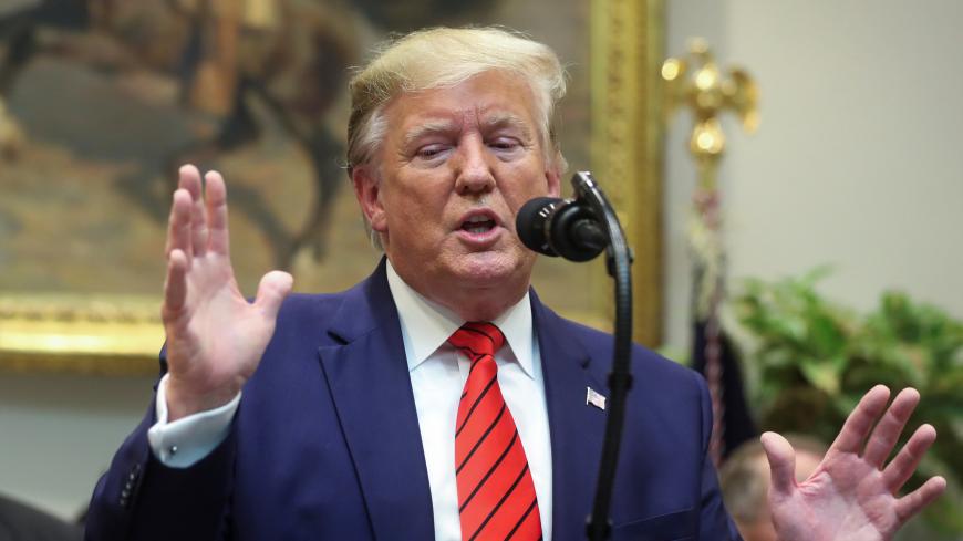 U.S. President Donald Trump answers questions from reporters during an event to sign executive orders on "transparency in federal guidance and enforcement" in the Roosevelt Room of the White House in Washington, U.S., October 9, 2019.  REUTERS/Jonathan Ernst - RC1D0C443790