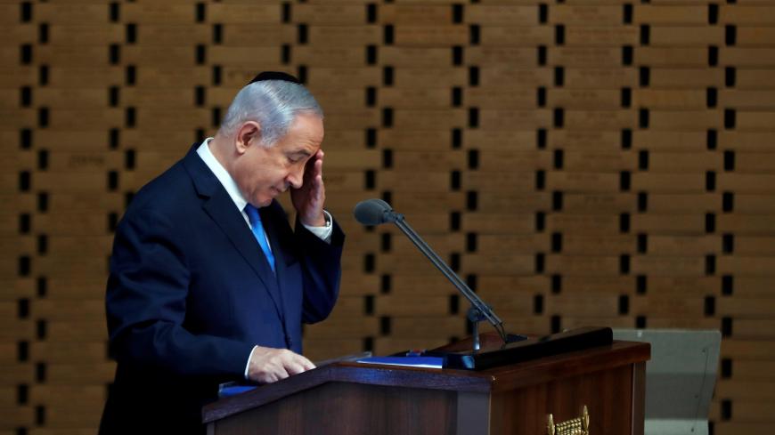 Israeli Prime Minister Benjamin Netanyahu gestures as he speaks during a memorial ceremony for Israeli soldiers killed in the 1973 Middle East War at Mount Herzl Military Cemetery in Jerusalem October 10, 2019. REUTERS/Ronen Zvulun - RC164B9F1A90