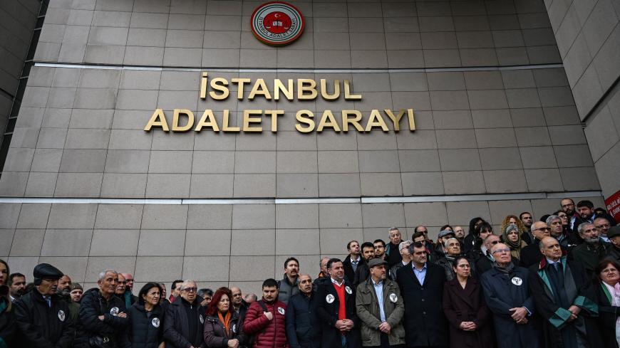 Lawyers and opposition MP's gather outside Caglayan courthouse on February 21,2019 in Istanbul, to protest against the upholding by an appeal court of the jail sentences against opposition journalists in a long-running case targeting the Cumhuriyet newspaper. - Last year 14 former Cumhuriyet staff, including journalists and executives, were given multiple sentences for "aiding and abetting terror groups without being a member" but they remained free pending trial. An appeals court in Istanbul said it unanim